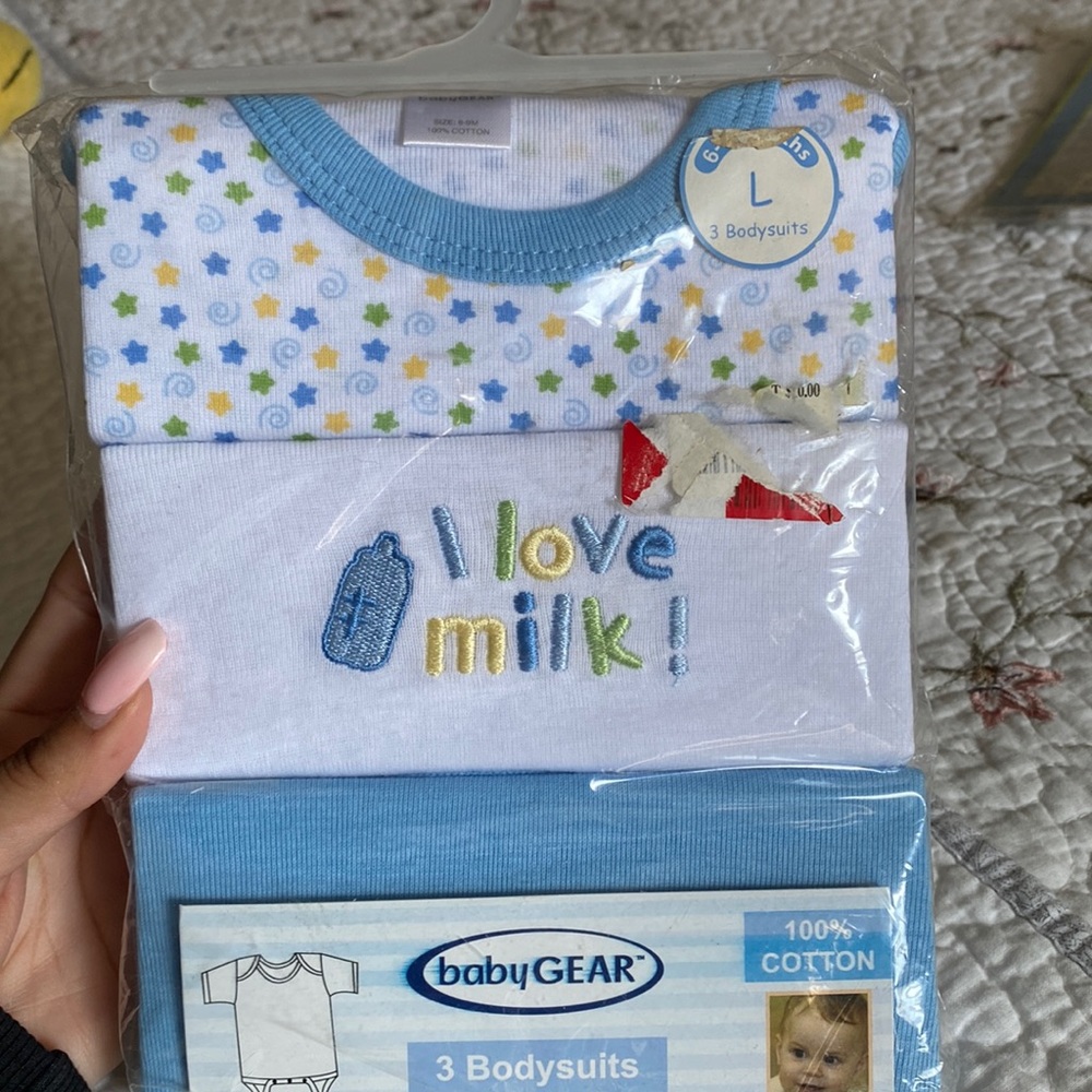 Brand new 3 pack bodysuits. 6-9 months